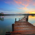 A calm lake at sunrise - facing cancer survival odds with faith in Jesus